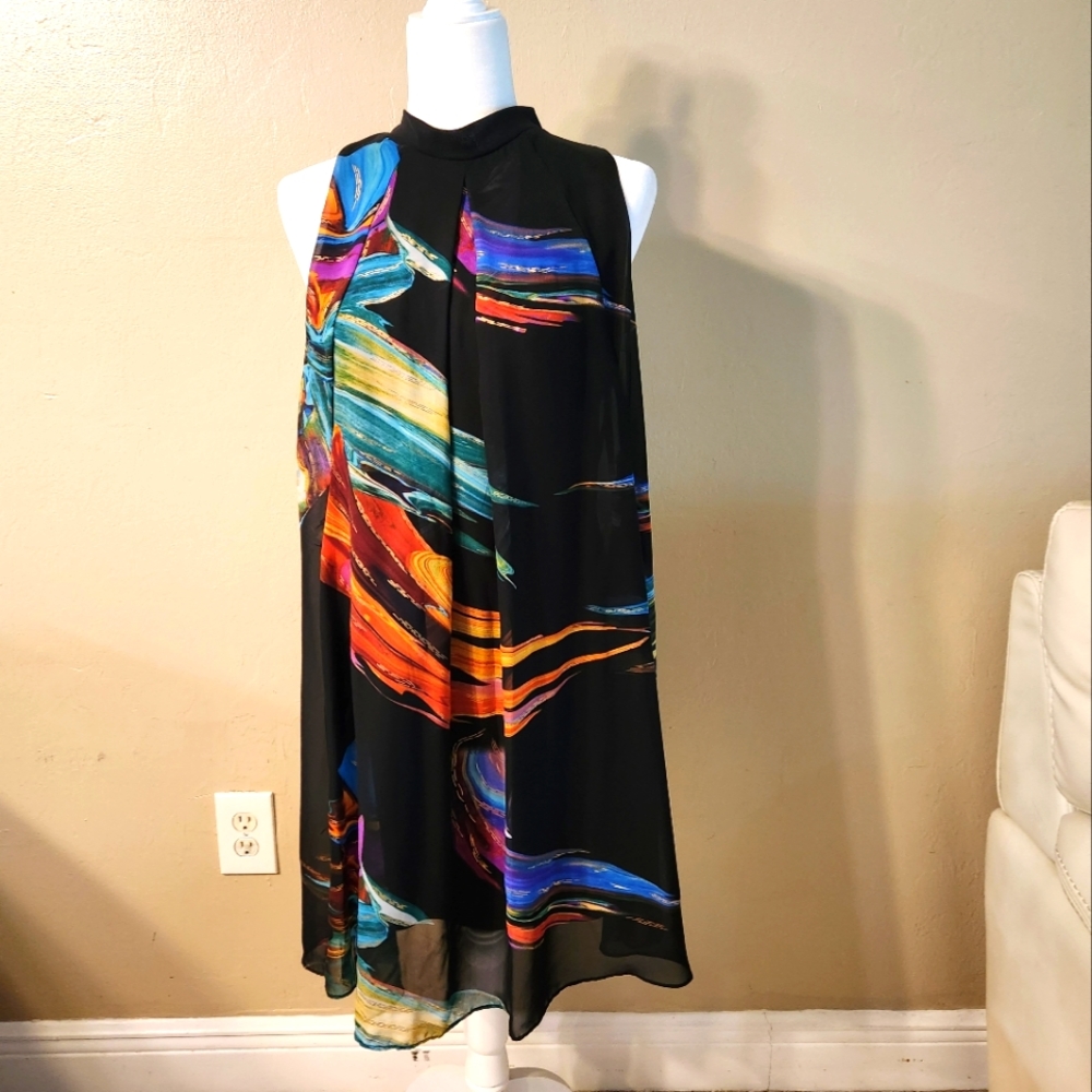 Flowy silk lined dress. Has tie kneck with scarf.